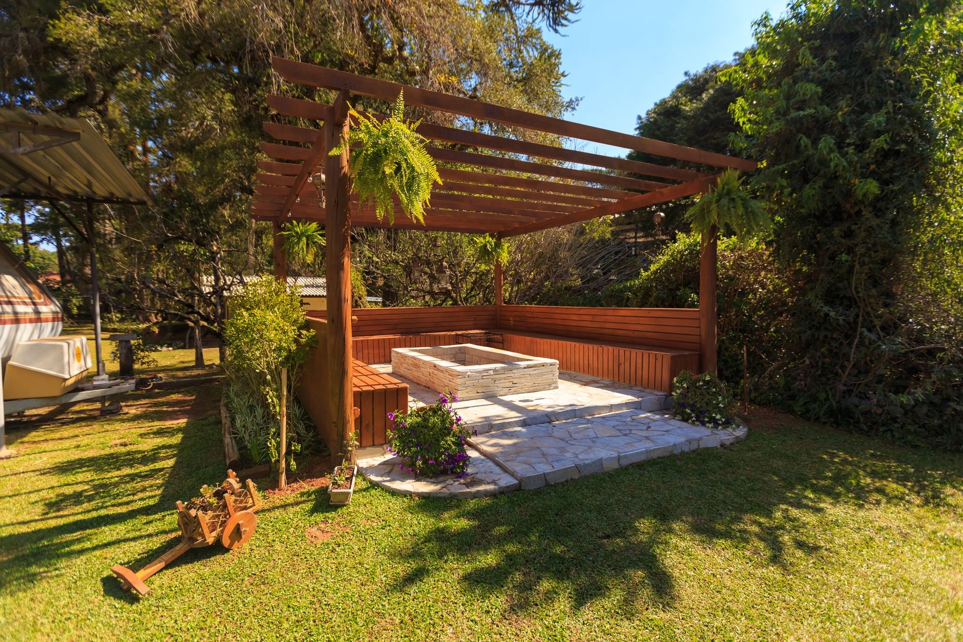 Landscaped backyard with a pergola and planted borders